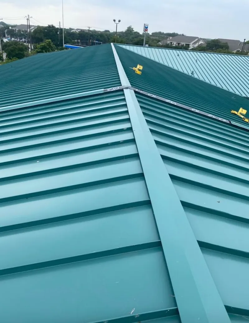 Green commercial metal roof ridge and valley for Metal Roof Repair in Merriam